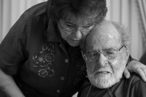 Senior Woman Comforting Senior Man.