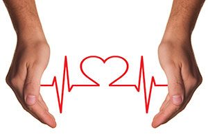 Heart Shaped ECG Between Hands.