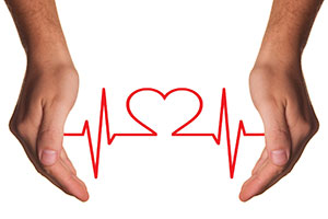 Heart Shaped ECG Between Hands.
