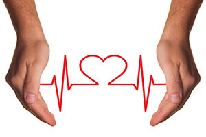 Heart Shaped ECG Between Hands.