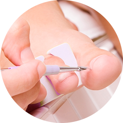 Close-up of foot nurse's hand while taking care of patient's toes.