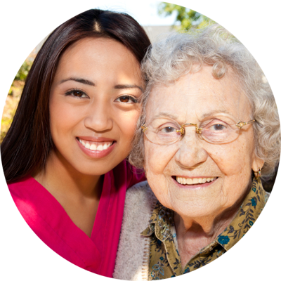 Personal support worker with senior woman, smiling.