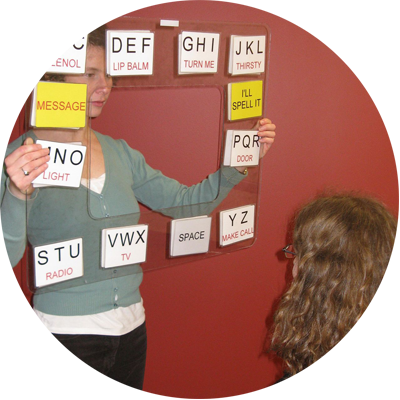 Speech Language Pathologist giving therapy to young girl.