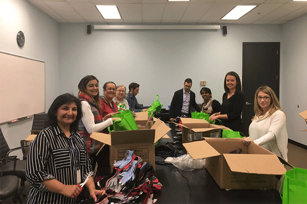 Closing The Gap Healthcare Staff Packing Gifts For Woodgreen Community Services.