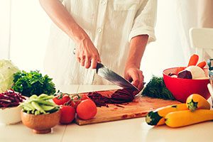 Woman Chopping Vegetables.