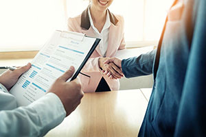 A Recruiter Shaking Hands With A Candidate After A Job Interview.