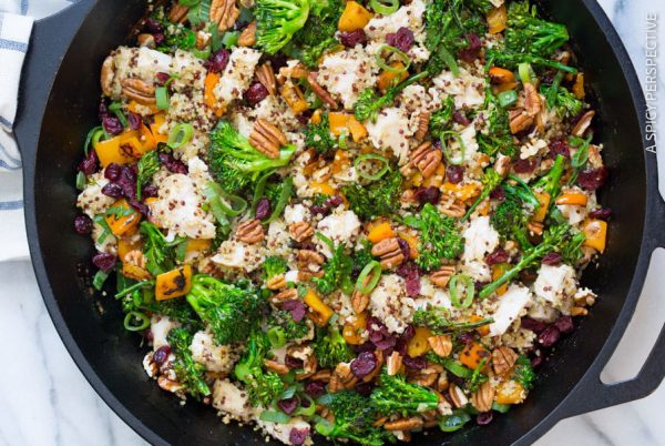 Heart-healthy dinner: Chicken broccoli quinoa skillet with yellow bell pepper, topped with scallions, pecans and dried cranberries.