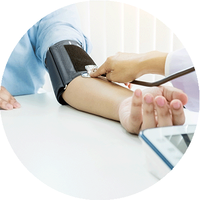 Close-up of of doctor taking blood pressure test of patient.