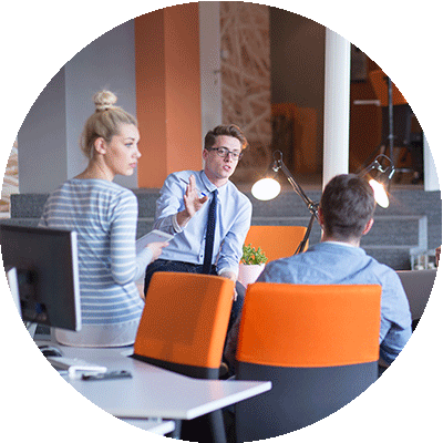 Employees discussing in a group wellness workshop.