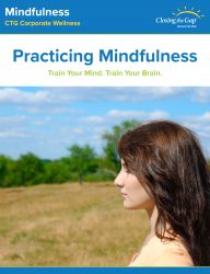 Mindfulness poster: Words that read "Practicing Mindfulness", "Train Your Mind. Train Your Brain" placed on top of image: girl standing in the meadow, eyes closed.